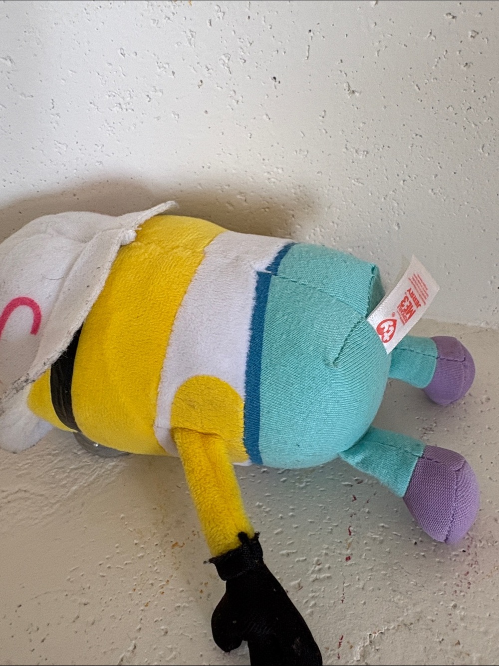 Universal Yellow Minion Plush with Pink and Purple Accessories - Picture 2 of 3